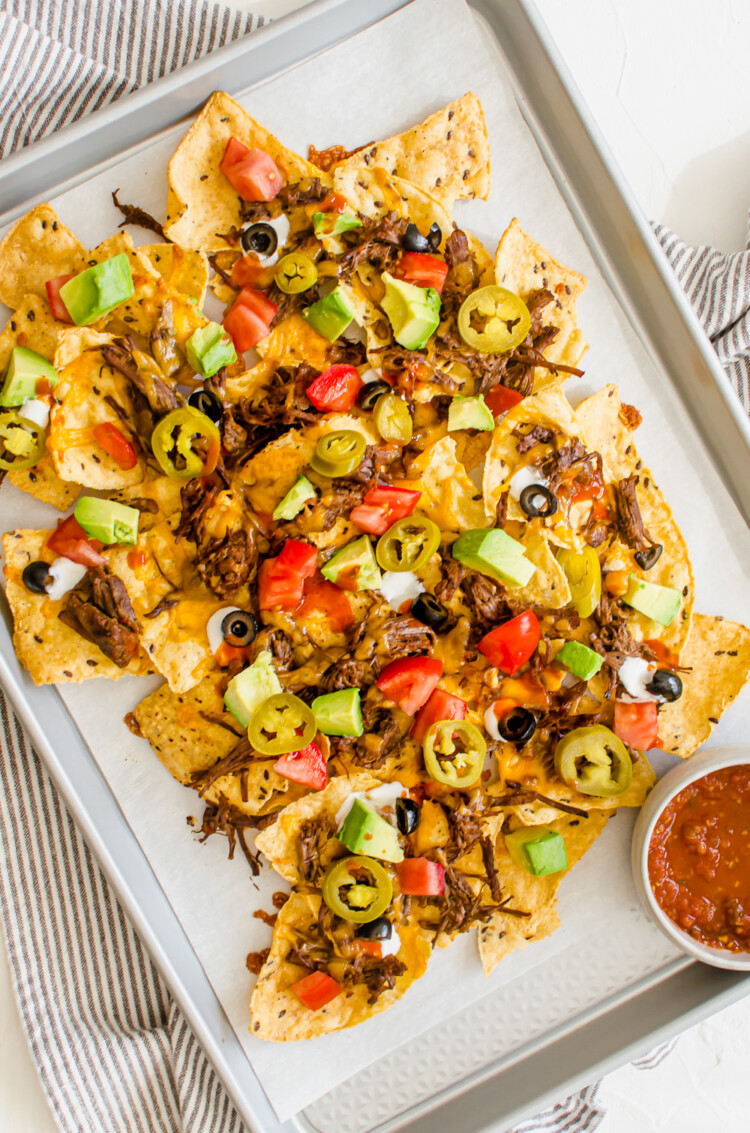 Shredded Beef Nachos on a pan after baking.