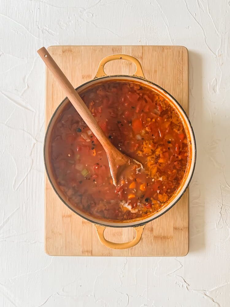 overhead process shot of tomato soup simmering
