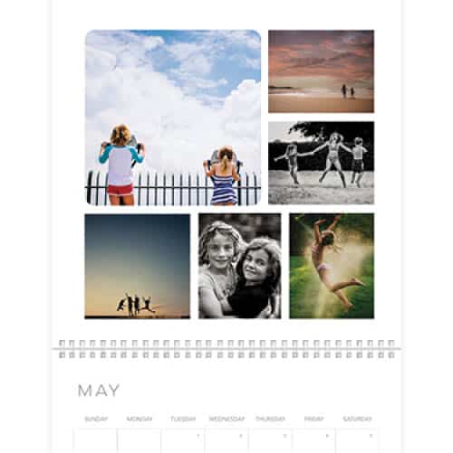 A wall calendar with a collage of family photos on top and the month of may grid on the bottom.