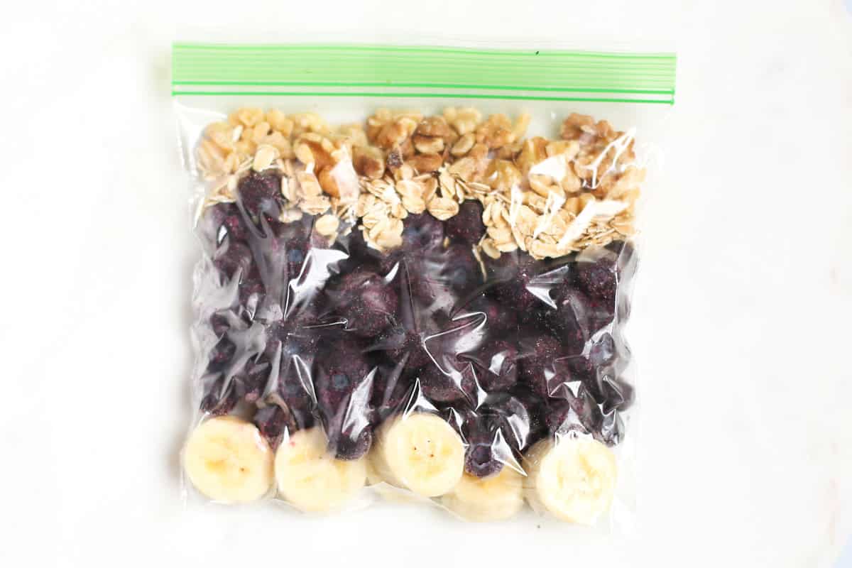 Blueberry muffin smoothie packed as a freezer smoothie pack in a ziplock bag. 