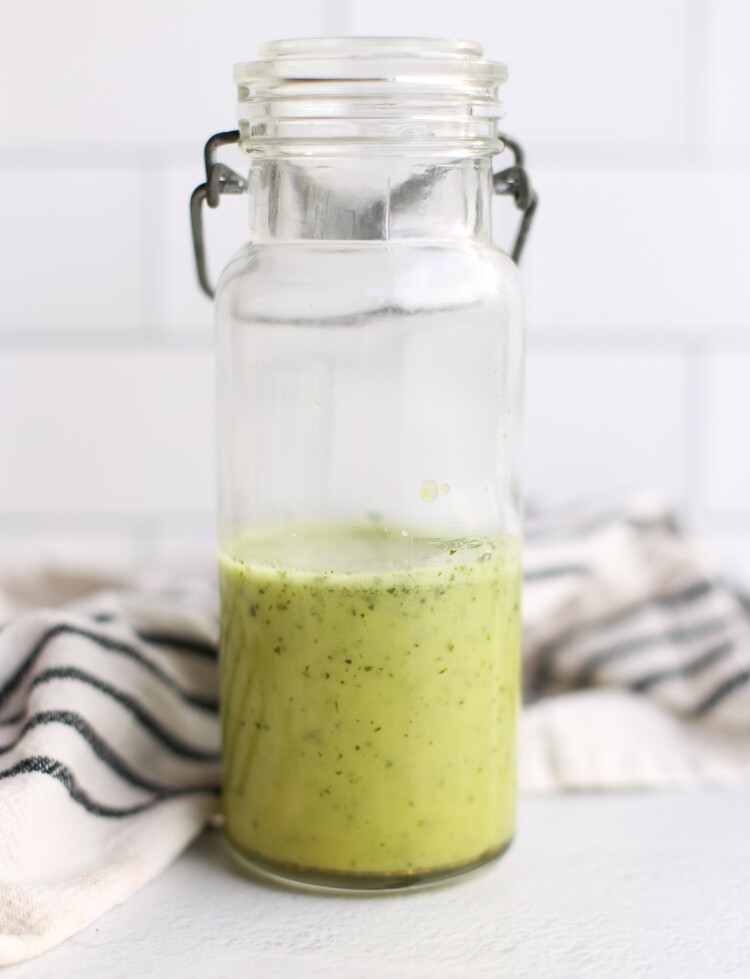 Cilantro Lime Vinaigrette in a jar sitting on a counter.