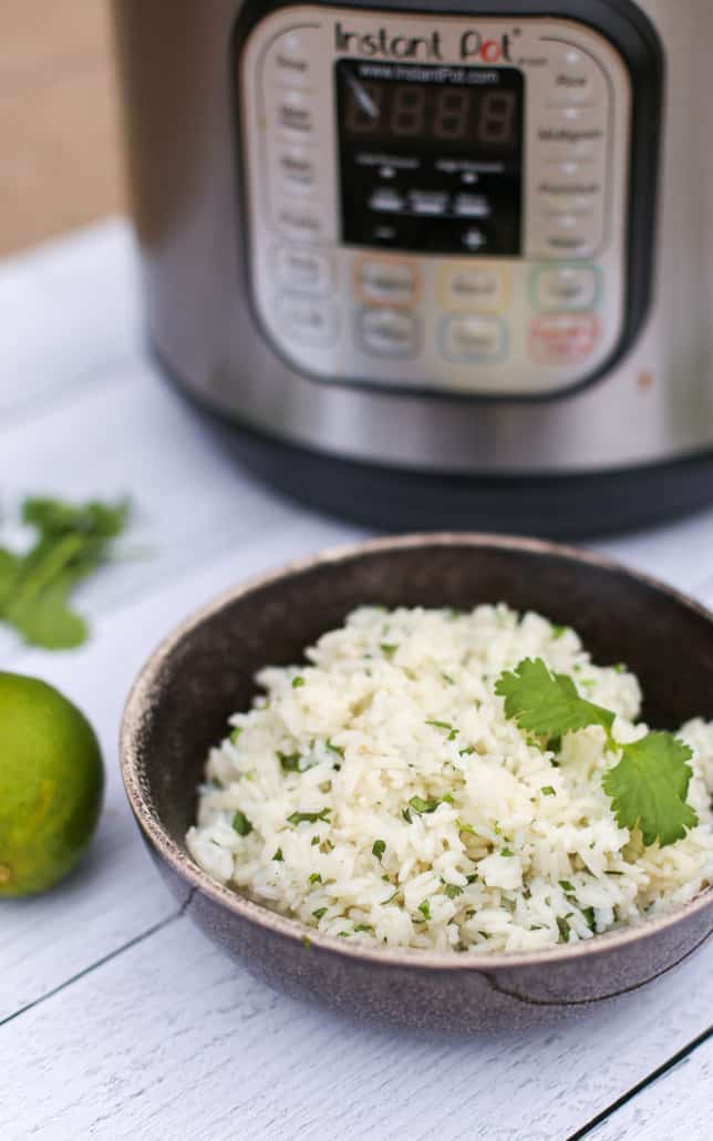 Cilantro Lime Rice in a bowl with and Instant Pot in the background