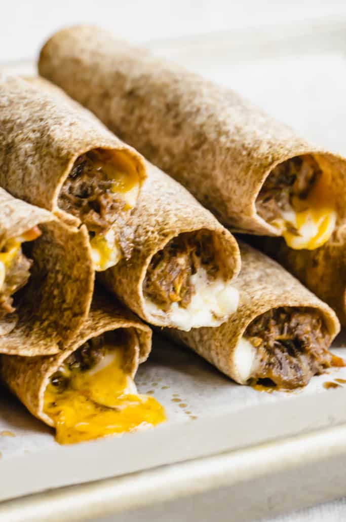Close up of shredded beef taquitos 