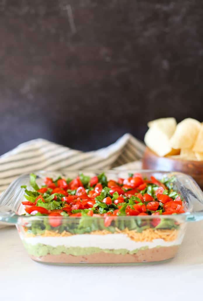 Layered Taco Dip in a glass dish