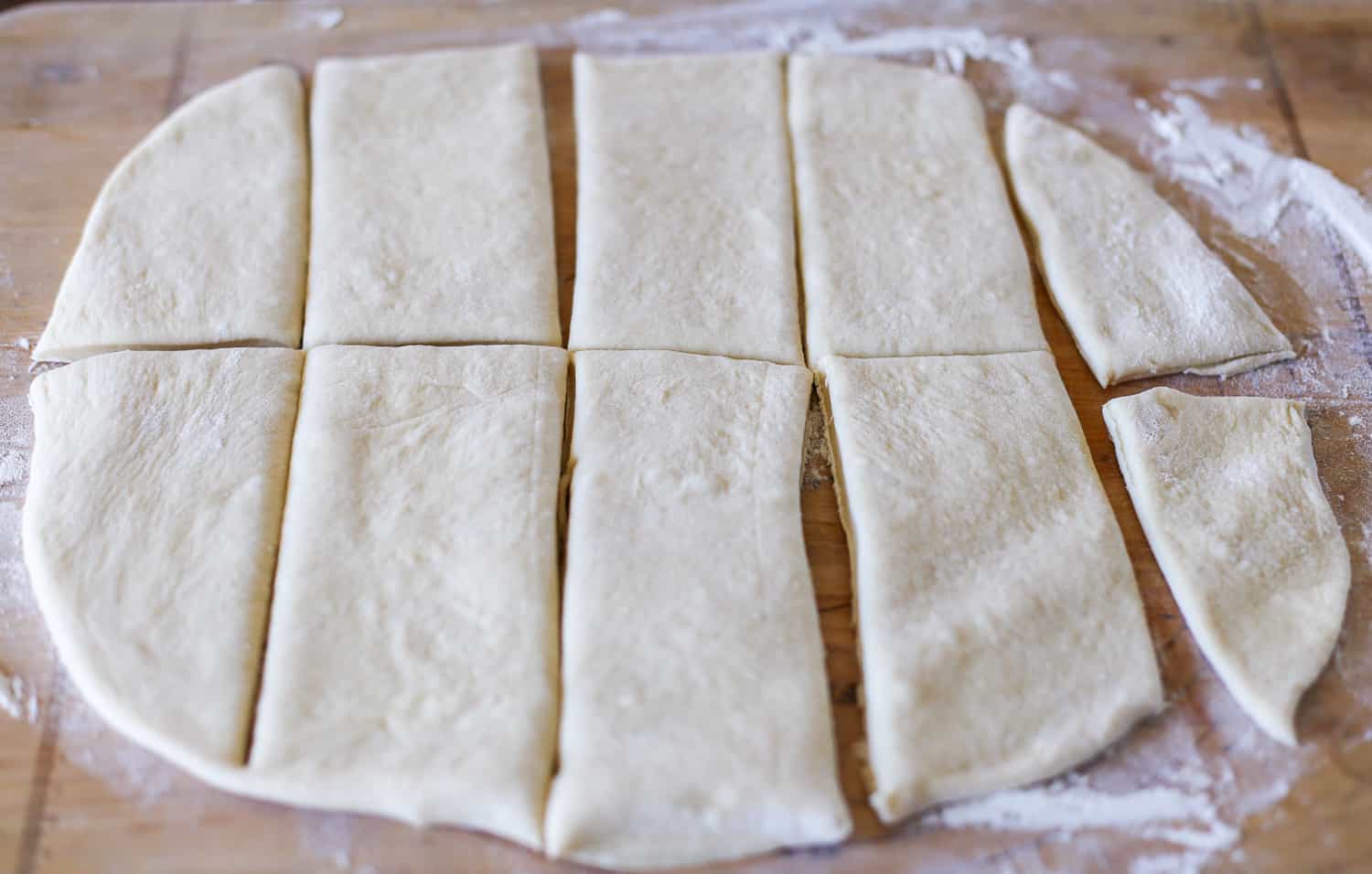 Panini bread dough rolled out and sliced up.