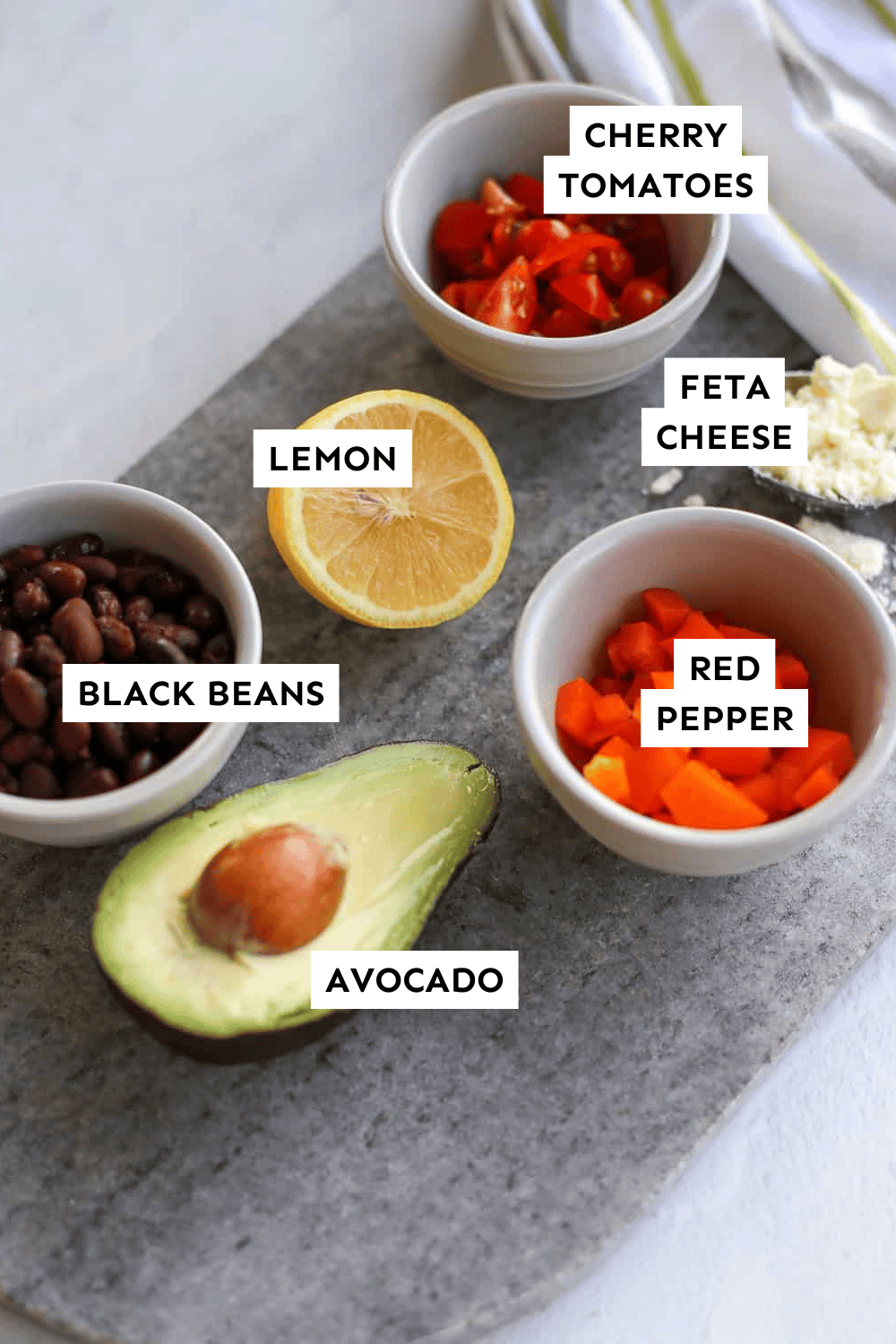 Ingredients for a protein bowl measured out and labeled.