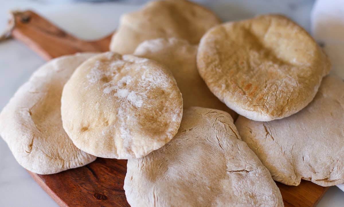 A pile of homemade whole wheat pita bread.