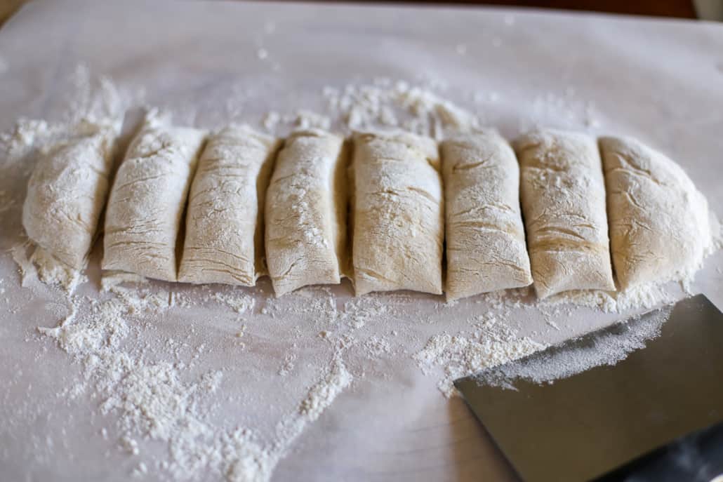 Dough being divided to make whole wheat pita bread