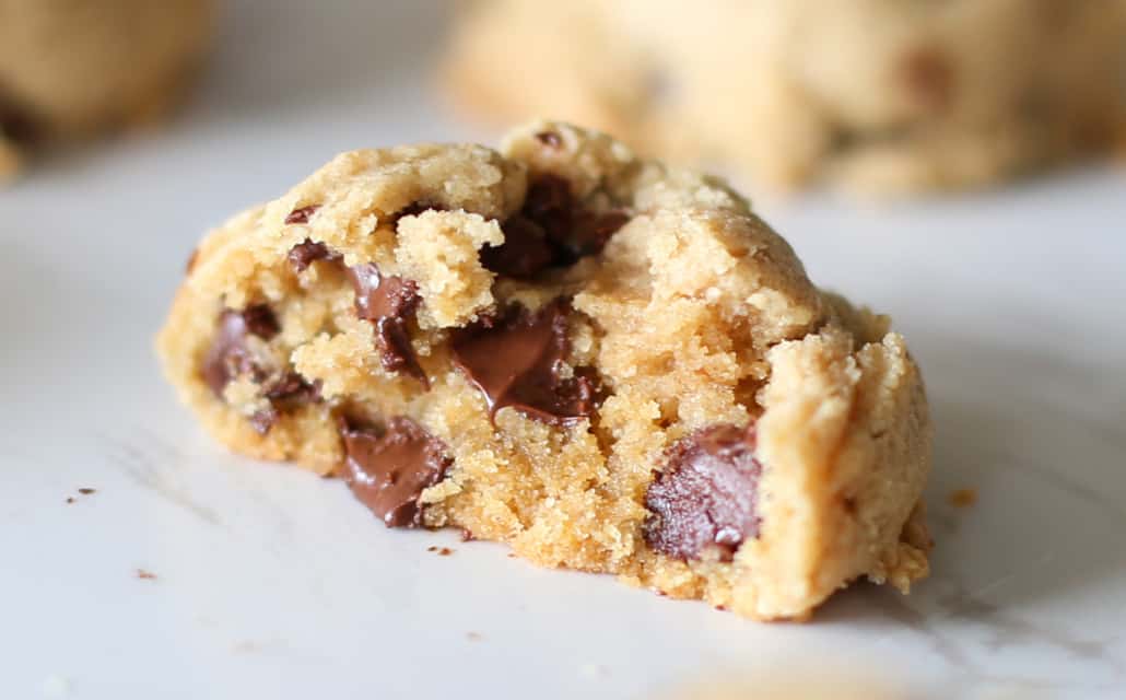 A whole wheat chocolate chip cookie split in half