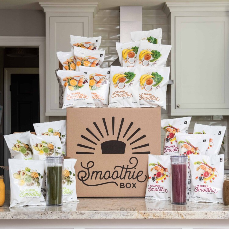 A large SmoothieBox box with frozen smoothie packs surrounding it