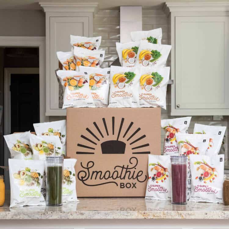 A large SmoothieBox box with frozen smoothie packs surrounding it.