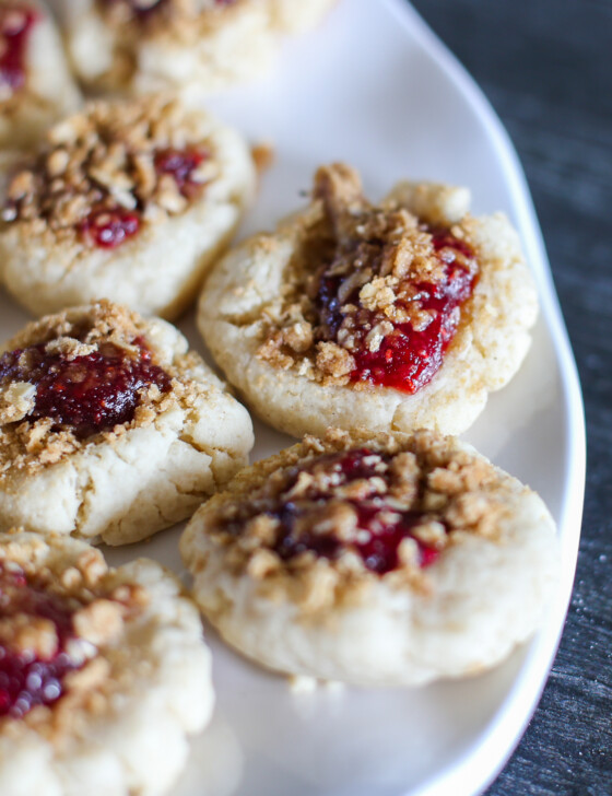 Raspberry crumble cookies on a white platter.