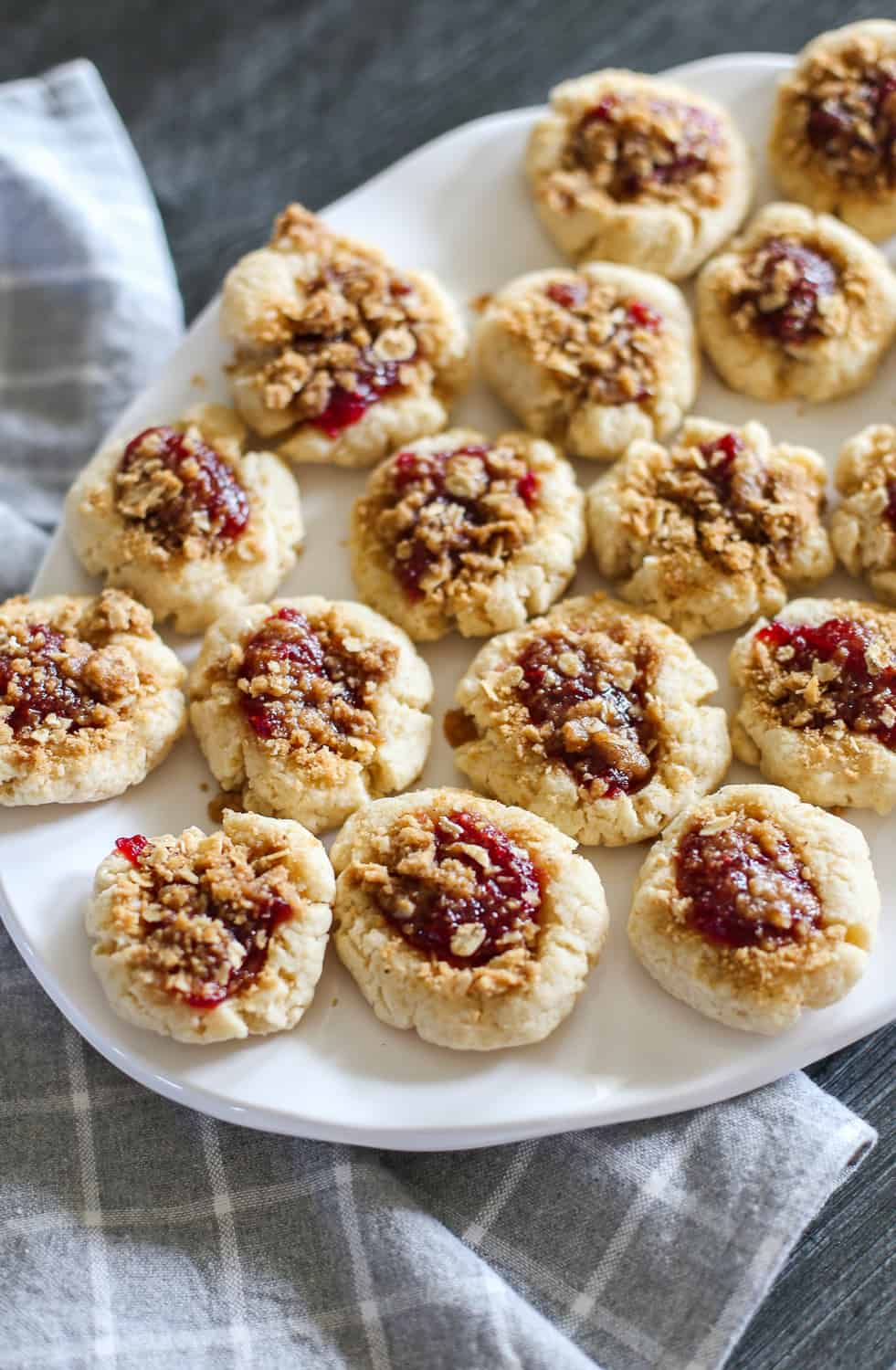 Raspberry crumble cookies on a white plate.
