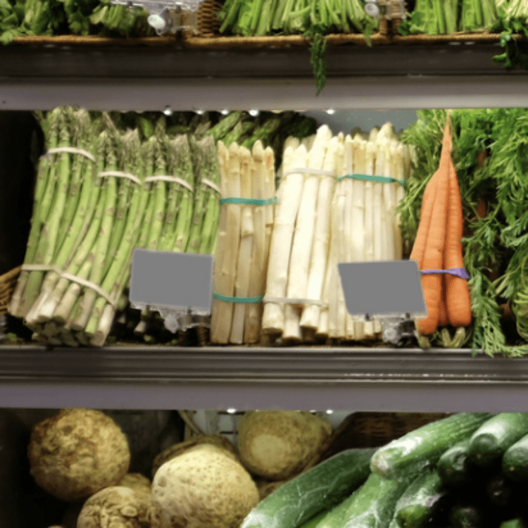 Asparagus on a produce shelf at the grocery store.