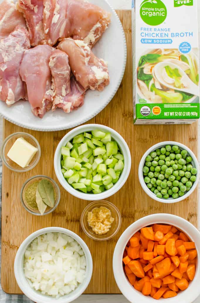 Ingredients for chicken and dumplings on a wooden cutting board