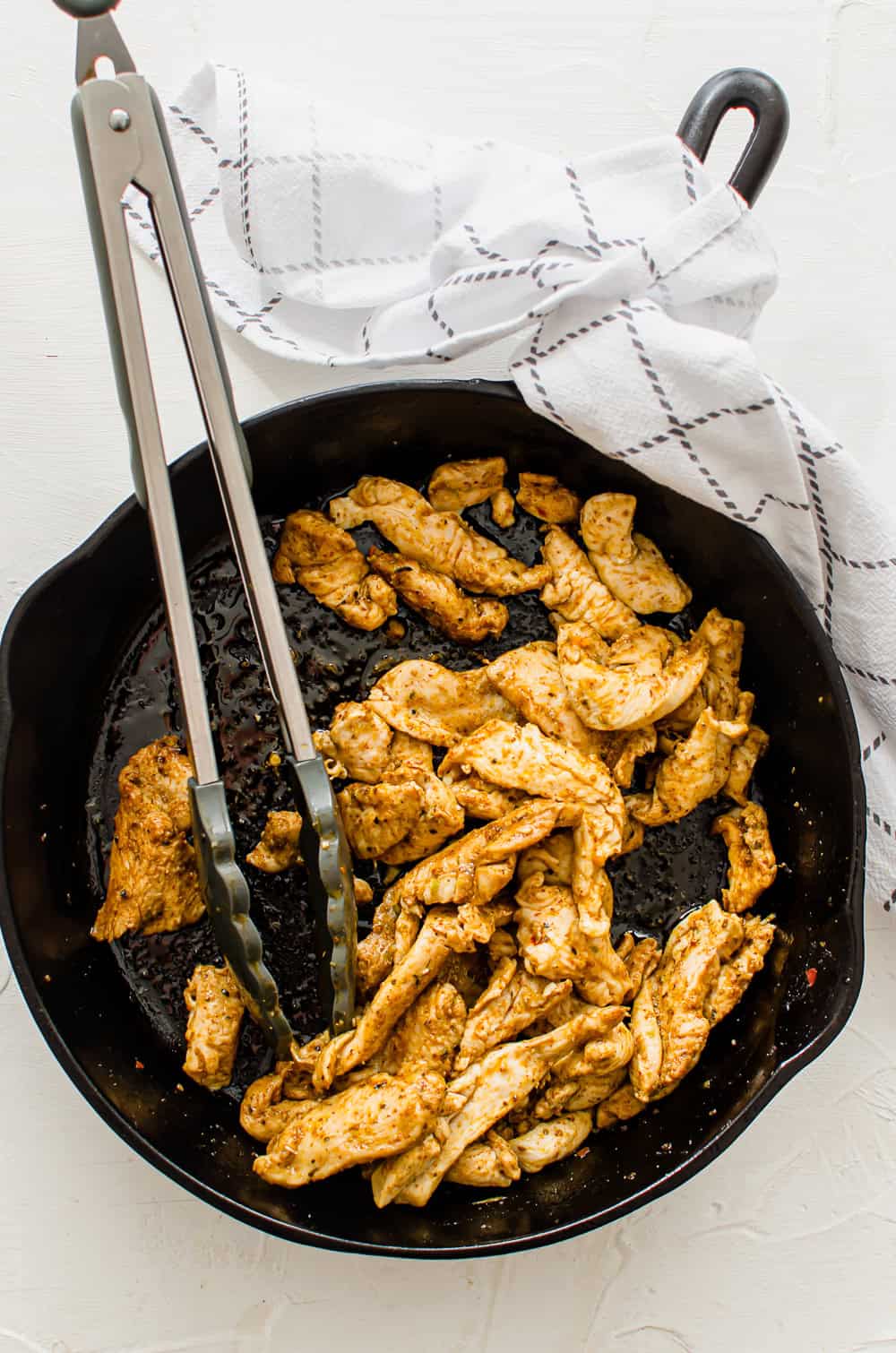 sautéed chicken in a cast iron skillet