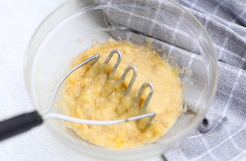 Mashed bananas in a glass bowl