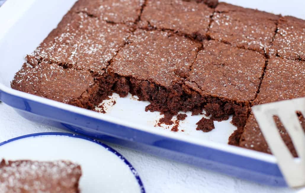Homemade brownies in a blue baking dish