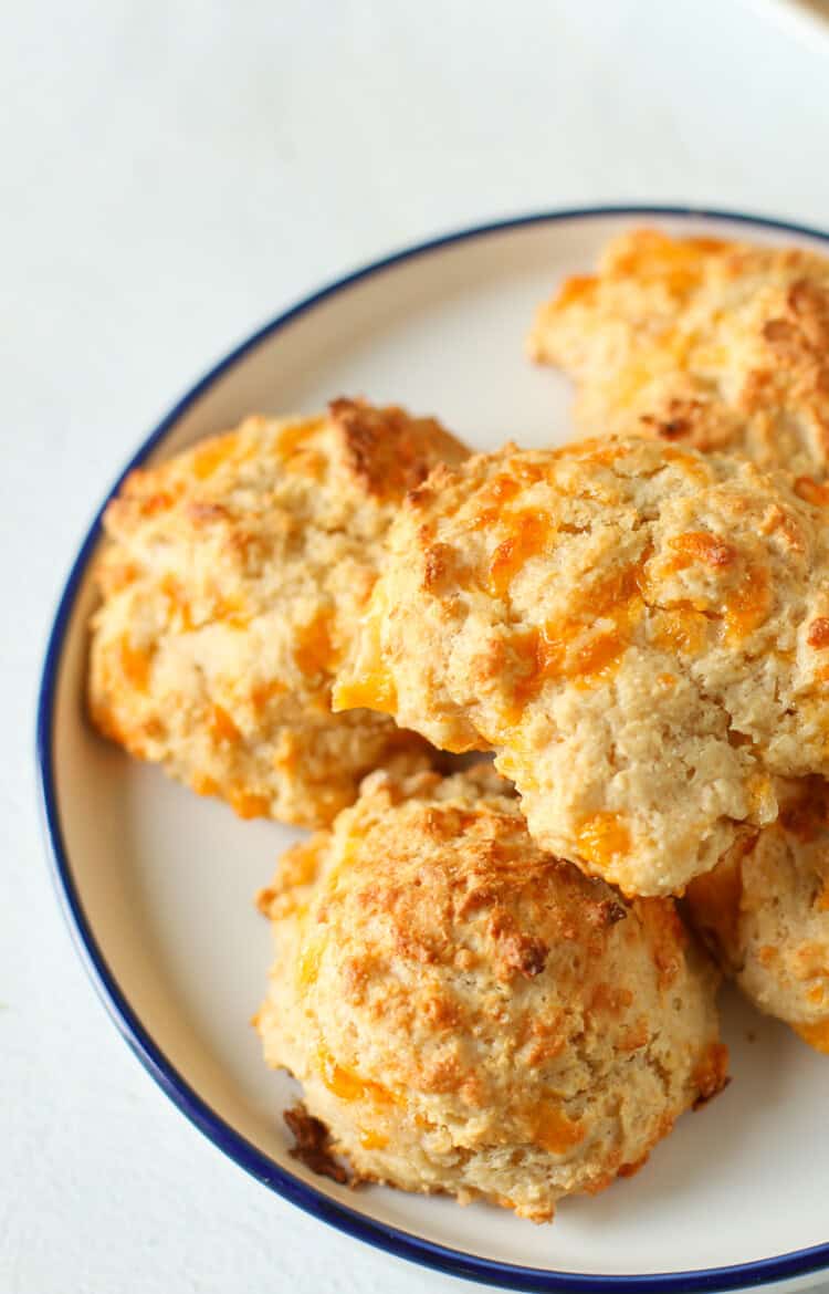 Copycat cheddar bisquits on a white plate.