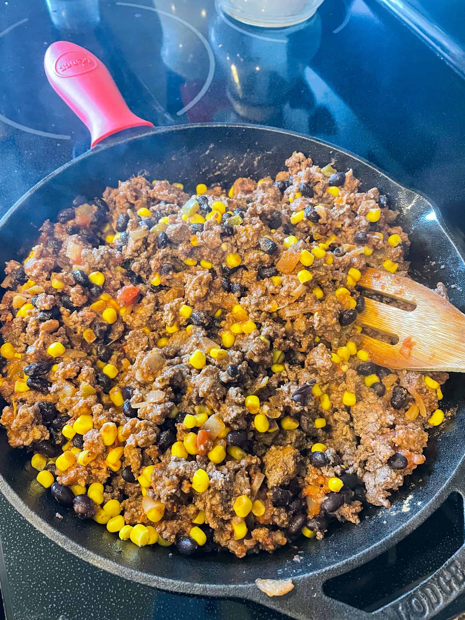 Mixture for beef quesadillas in a cast iron skillet.