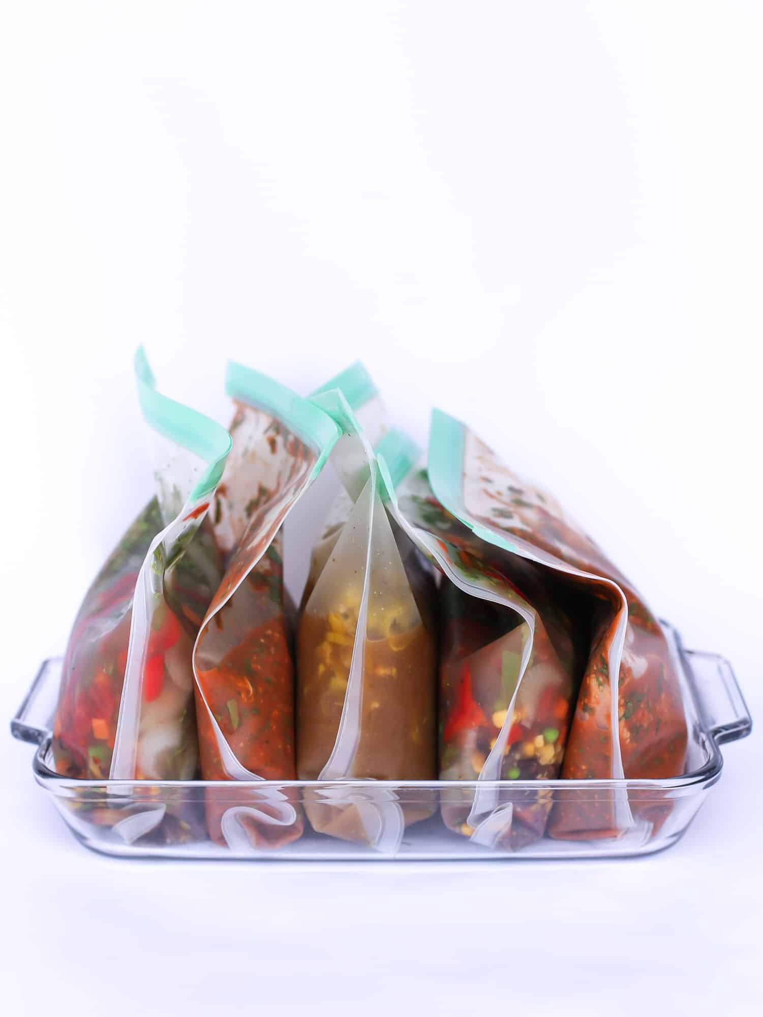 A collection of freezer meals in reusable bags. 