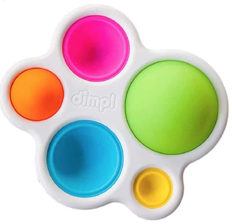 Plastic dimpl toy has five different color and different size rubber parts that push in and out.