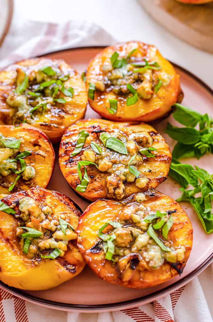 savory grilled peaches on a plate