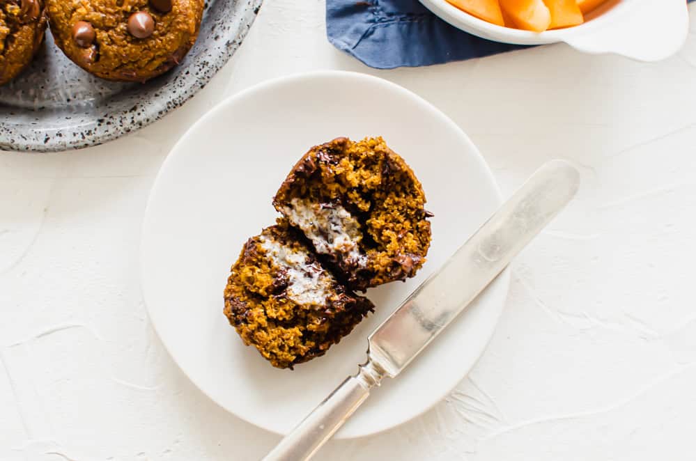 Pumpkin chocolate chip muffin split in half.