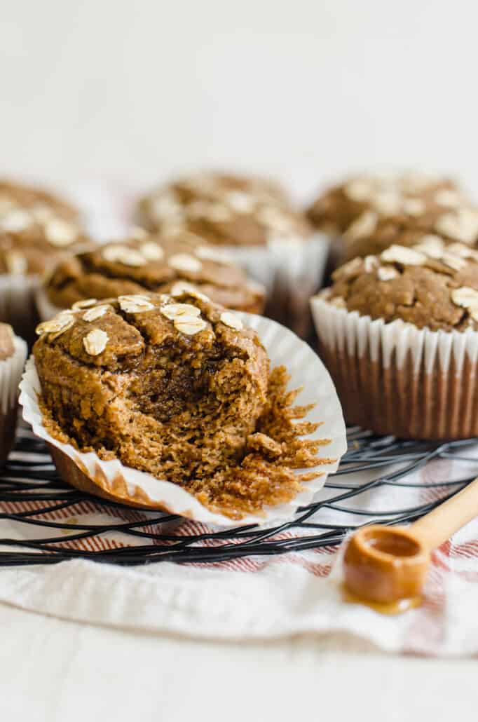 side shot of a gluten free banana muffin with a bite taken out of it