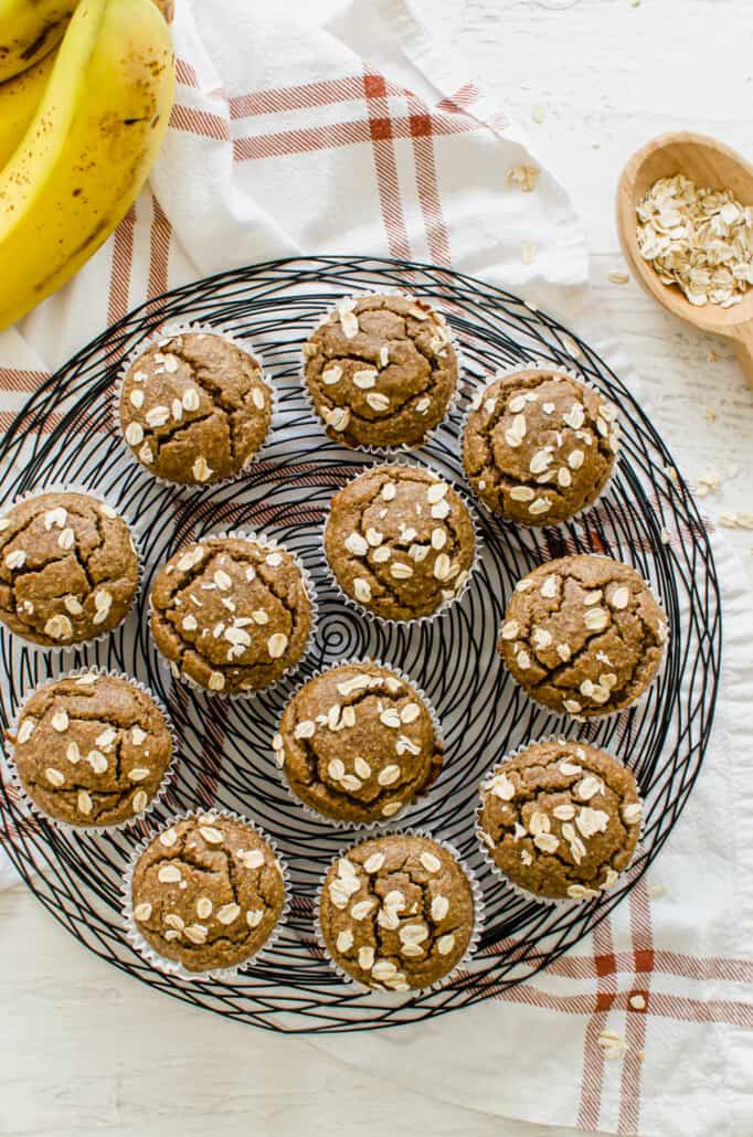 overhead vertical shot of gluten free banana muffins with oats on top