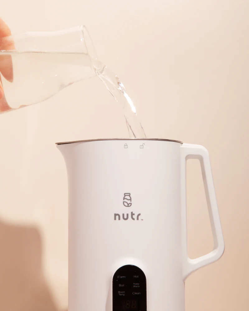 Pouring water in a Nutr machine.