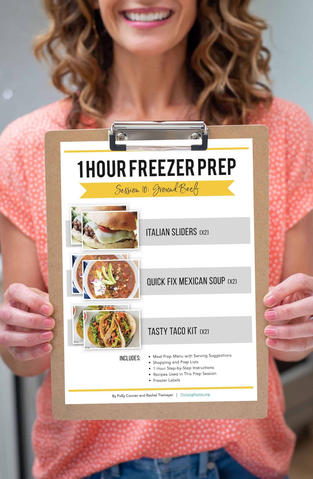Woman holding a clip board with 1 Hour Freezer Prep Session 10.
