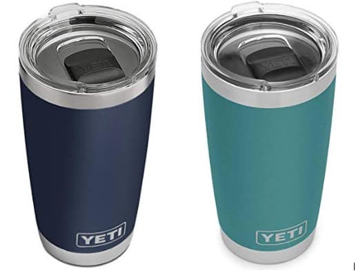 A navy and an aqua Yeti Travel Tumbler sitting side by side.