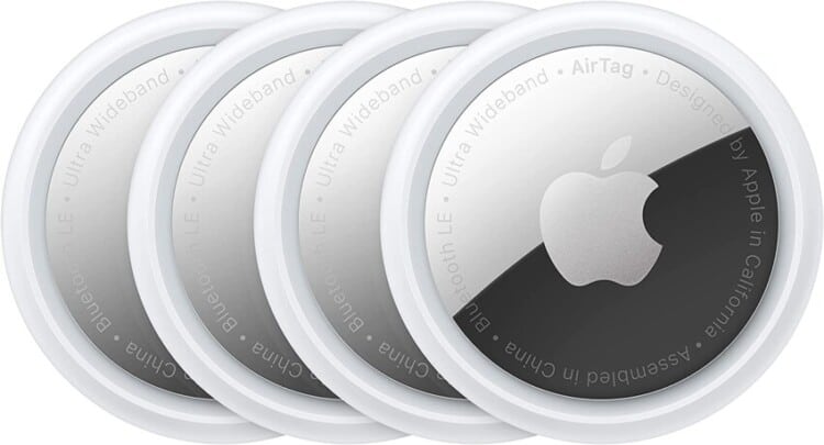 Four apple air tags lined up.