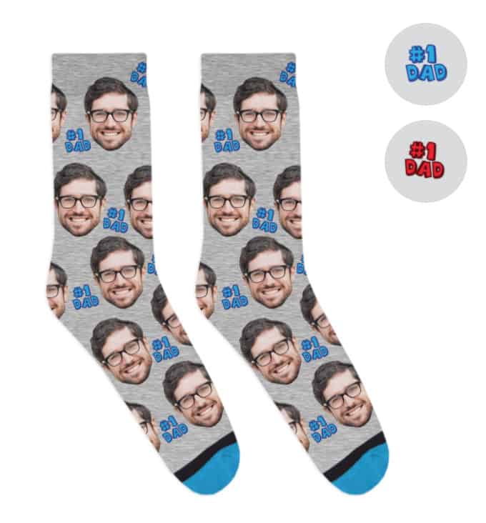 A pair of socks with a man's face and the words, #1 dad, all over them.