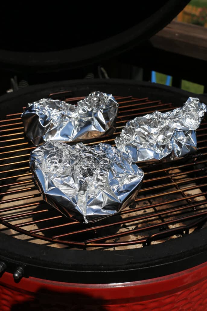 Foil packs of vegetables on the grill 