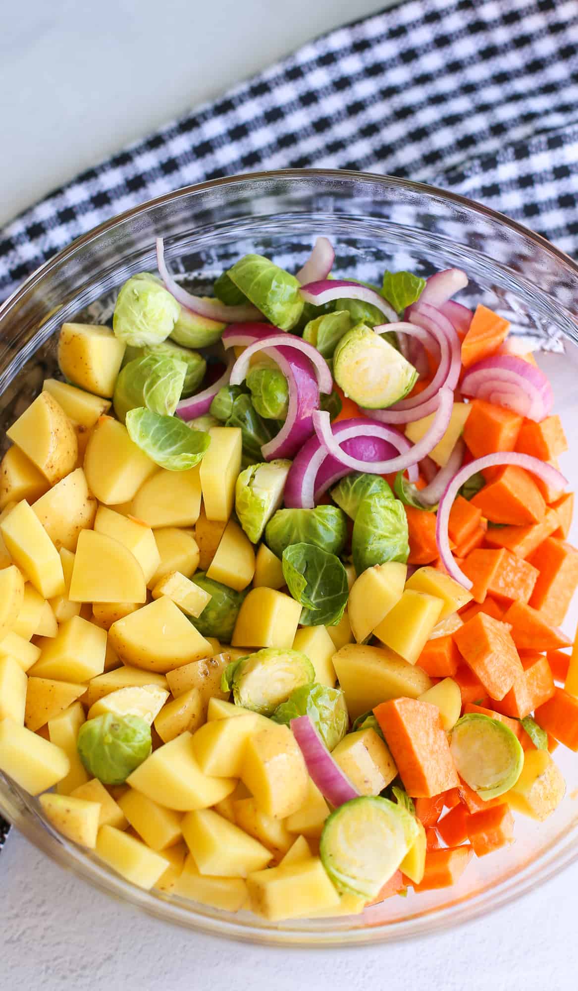 A bowl of cut up vegetables ready to grill.