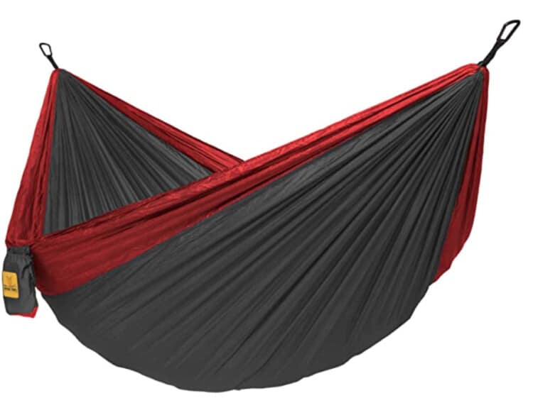 A gray hammock with red trim.
