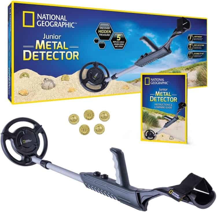 Stock photo of the box for a National Geographic junior metal detector with one sitting in front of the box.