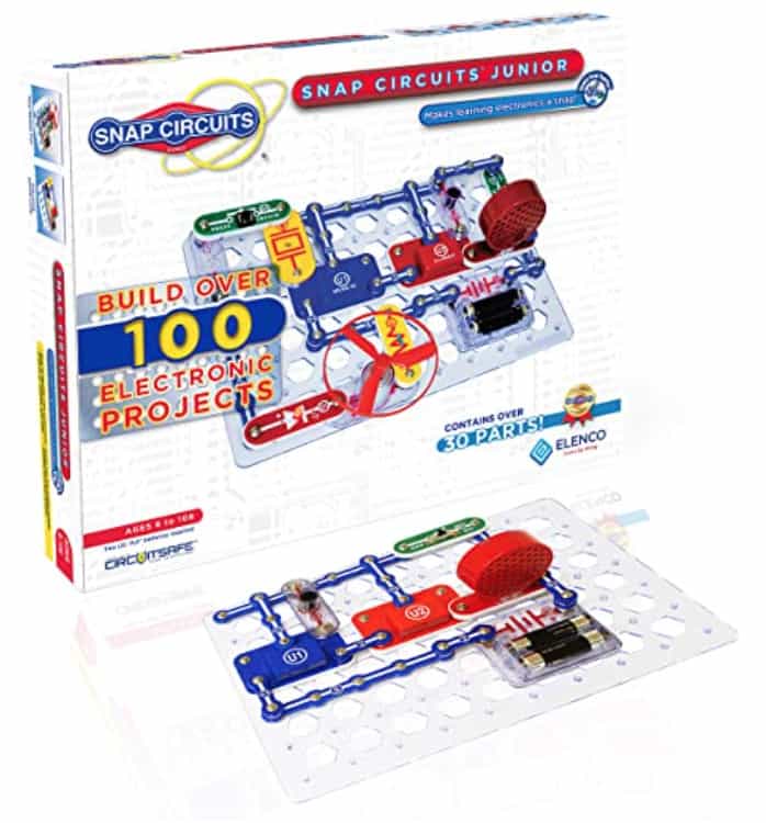 Stock photo of box for Snap Circuits Jr with a snap circuit board in front of it with some of the pieces connected.