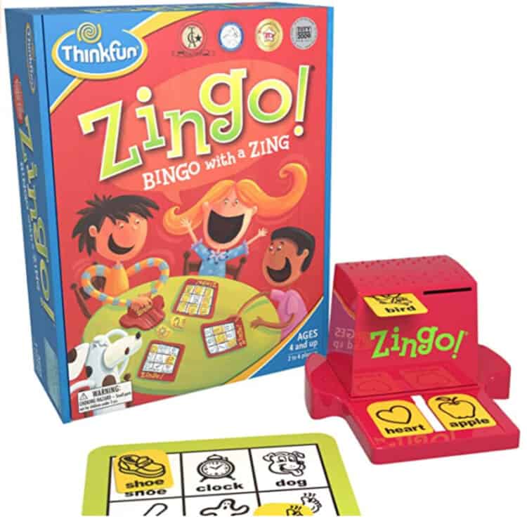Stock photo of the box for Zingo with pieces to the game sitting in front of the box.
