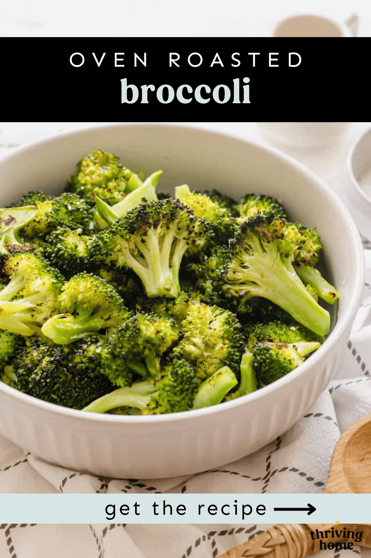 Roasted broccoli served in a white bowl.