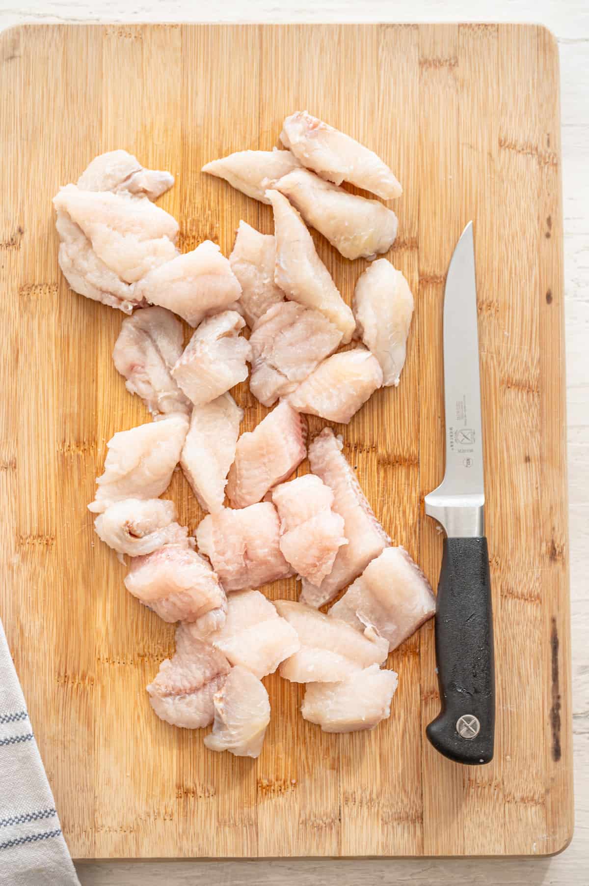 Cut up catfish nuggets.