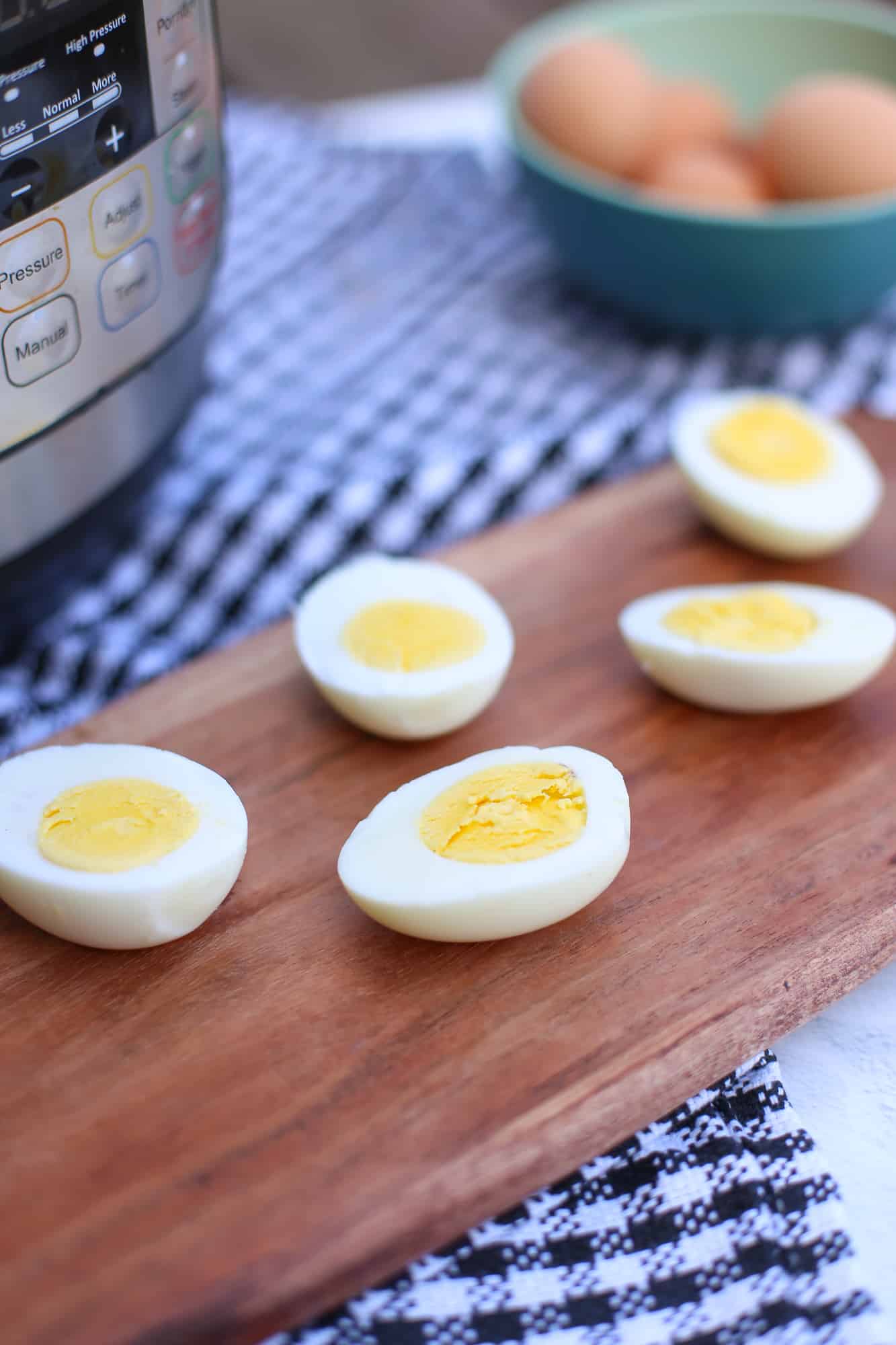 hard boiled eggs with an instant pot in the background.