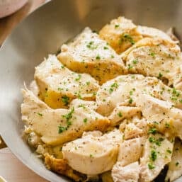 chicken sliced from whole chicken on a serving platter