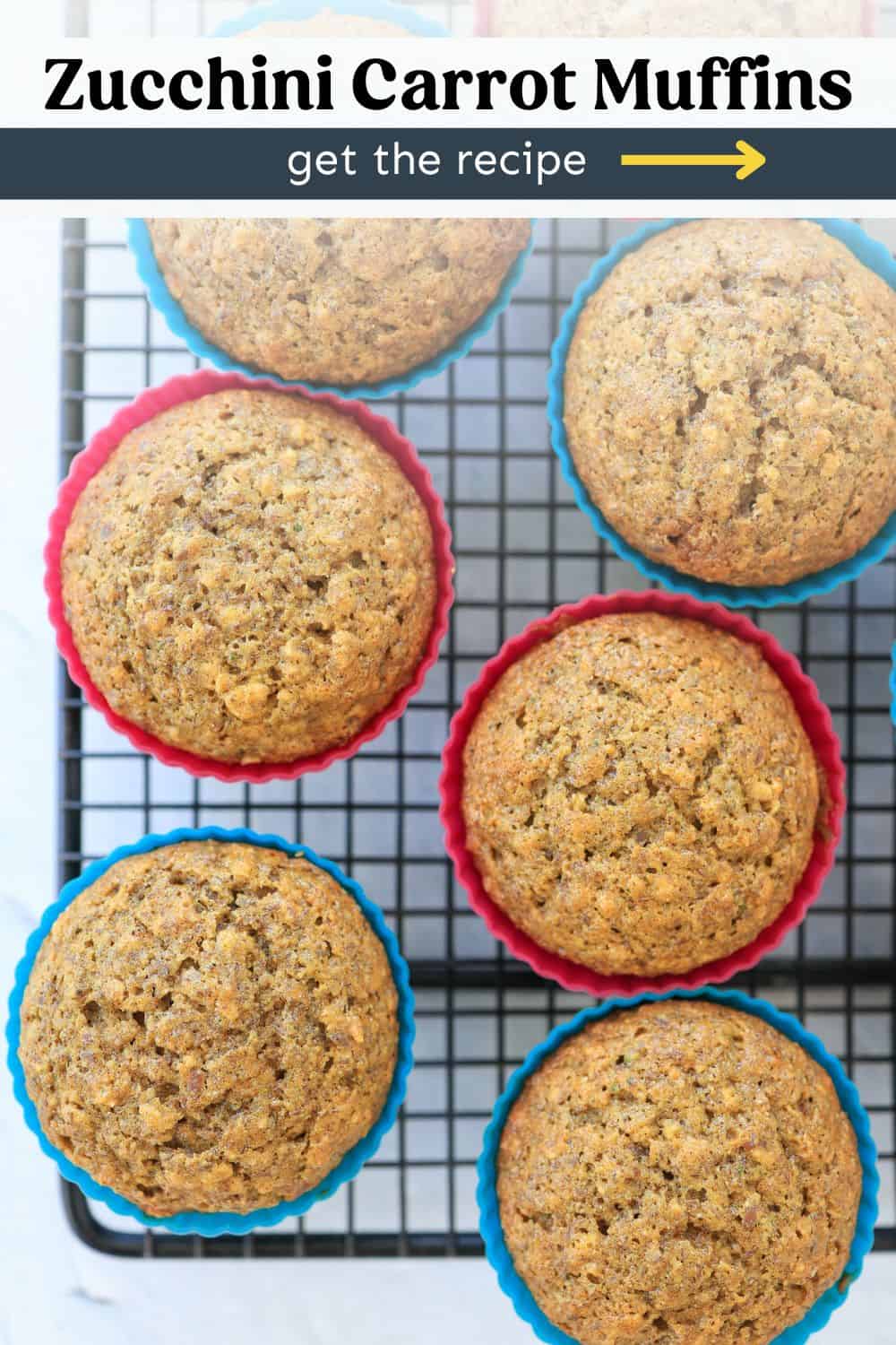 Muffins on a cooling rack in pink and blue silicone liners. 