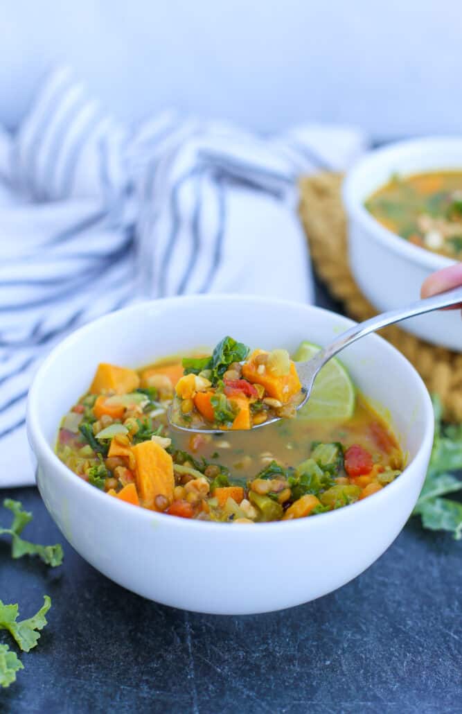 Coconut Curry Soup in a bowl with a spoon