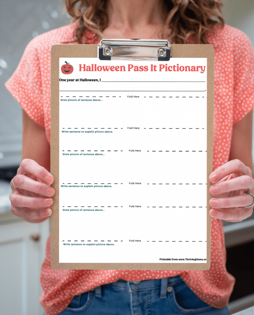 Clipboard holding Halloween Pass It Pictionary game