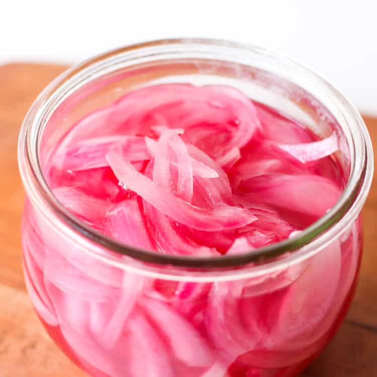 pickled red onions in a mason jar