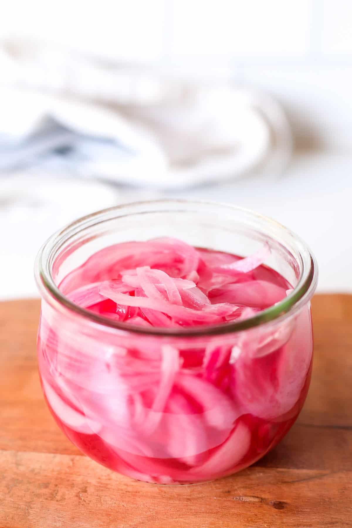 Pickled red onion in a mason jar.